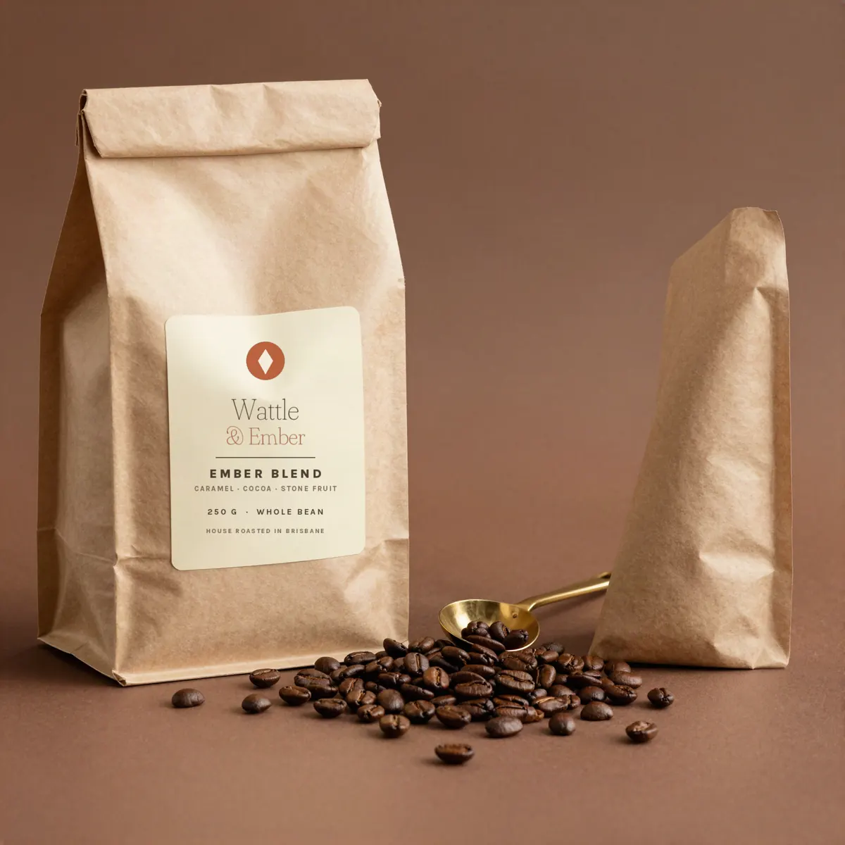 Freshly roasted coffee beans and a kraft bag