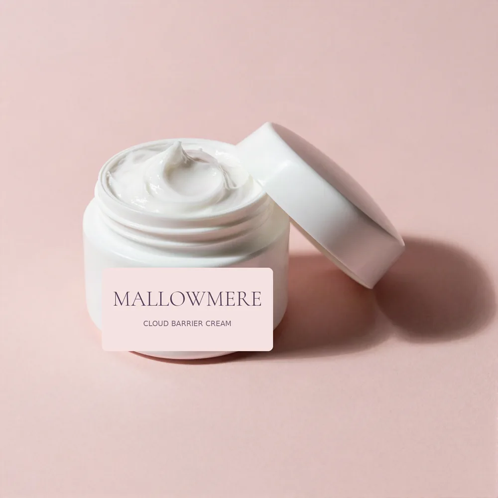 Open jar of Mallowmere Cloud Barrier Cream with its lid beside it